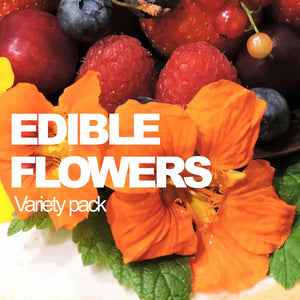 Assorted edible flowers from SeedsNow-SeedBanks' all-in-one variety pack, showcasing vibrant, fresh blossoms on a neutral background.
